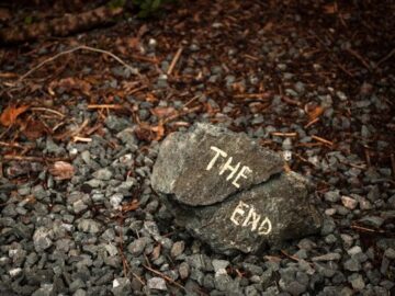 a rock with the word the end written on it